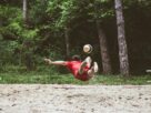 a man catching a frisbee