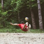 a man catching a frisbee