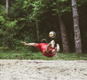 a man catching a frisbee