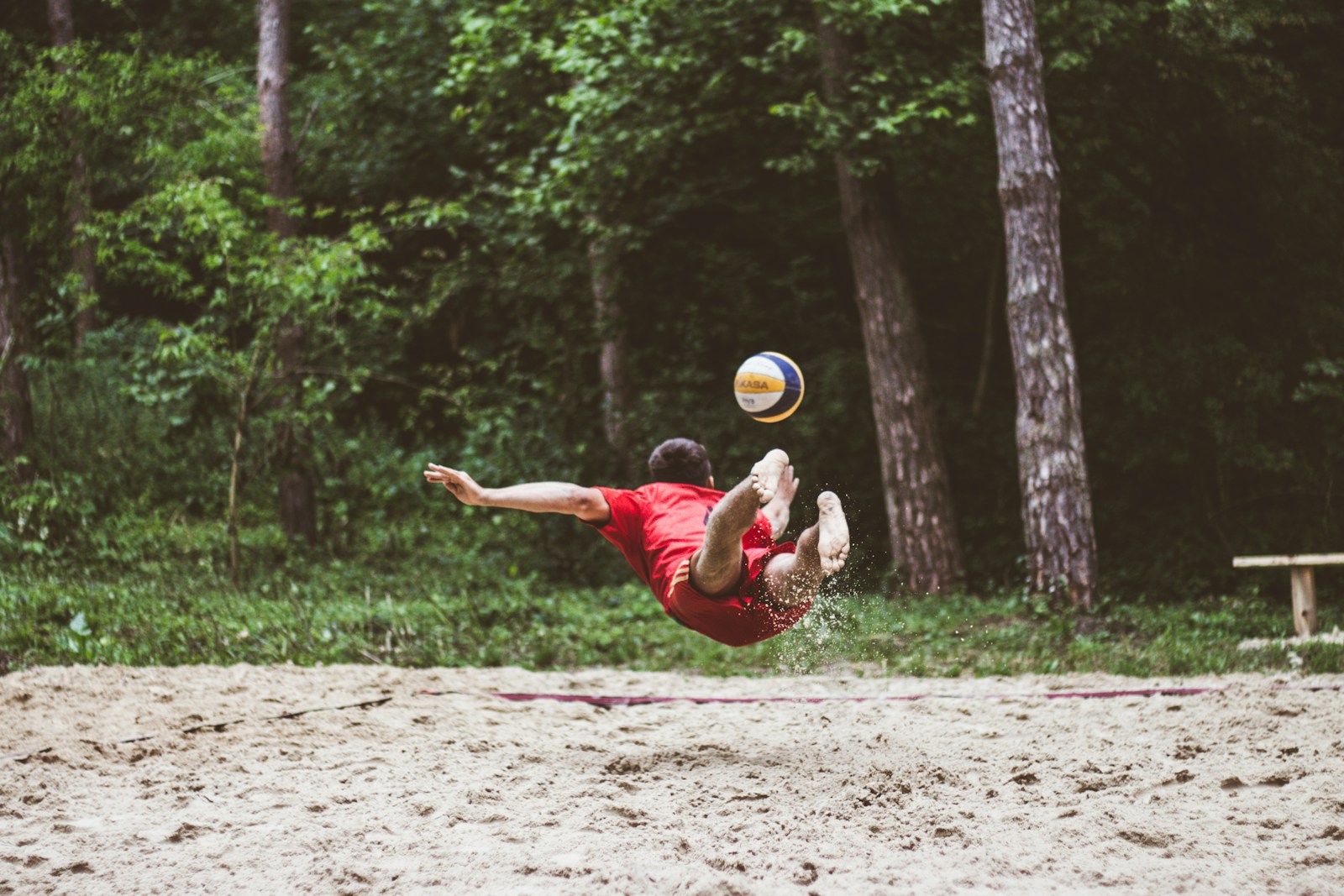 a man catching a frisbee